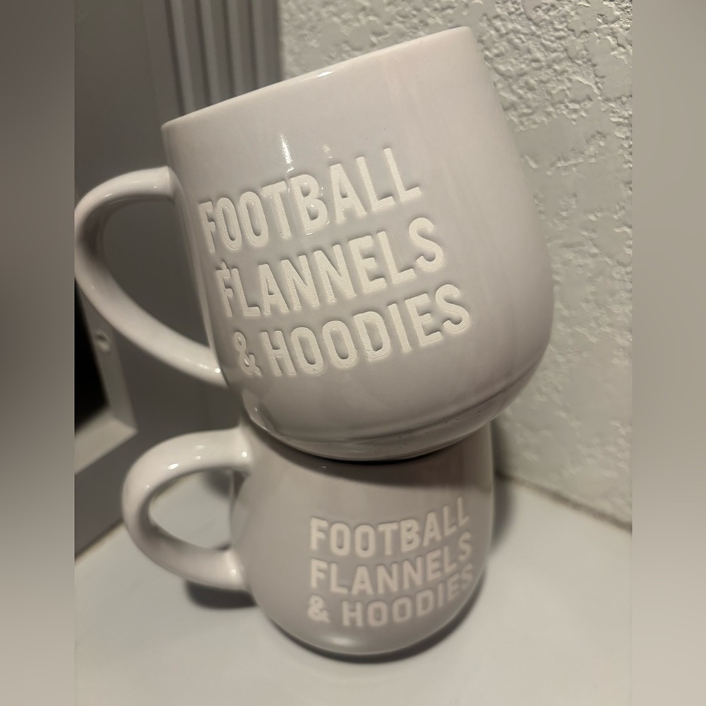 Pair light gray ceramic mug with the phrase "FOOTBALL FLANNELS & HOODIES"